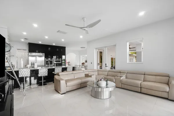 a living room with lots of furniture and white walls