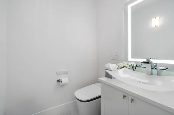 a bedroom with a bed and ceiling fan