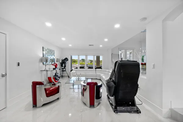 a view of a livingroom with furniture and a potted plant