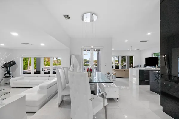 a living room with fireplace furniture and a flat screen tv