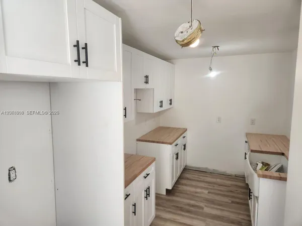 a hallway with cabinets