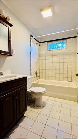 a bathroom with a toilet a sink and a bathtub