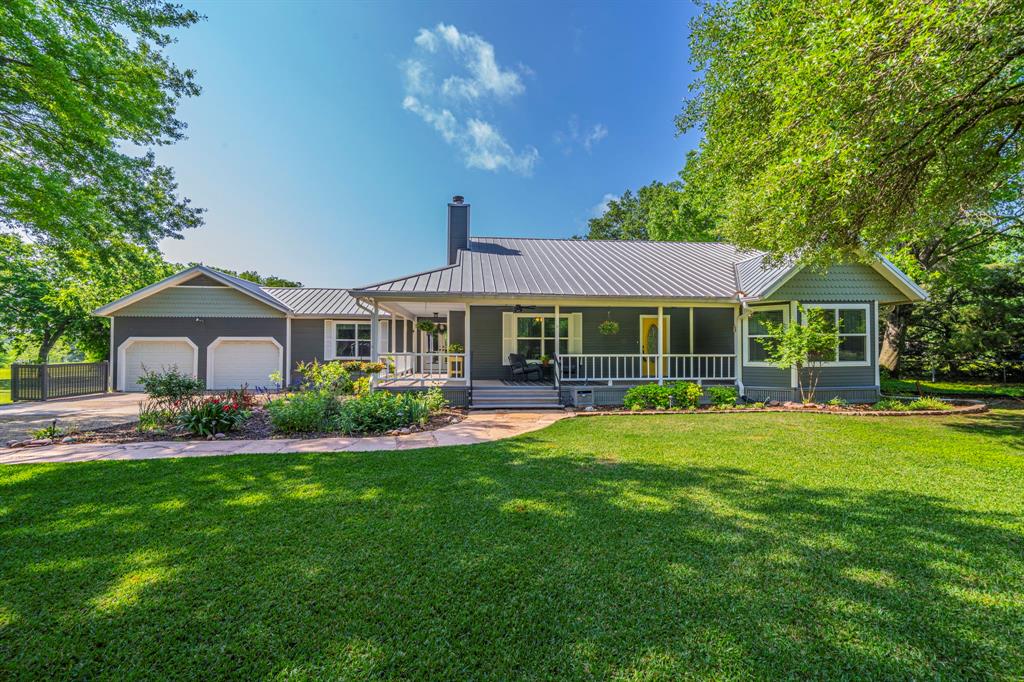 3992 Hartlee Field Road Denton, TX 76208 - Photo 1 of 1 a front view of a house with a yard porch and furniture