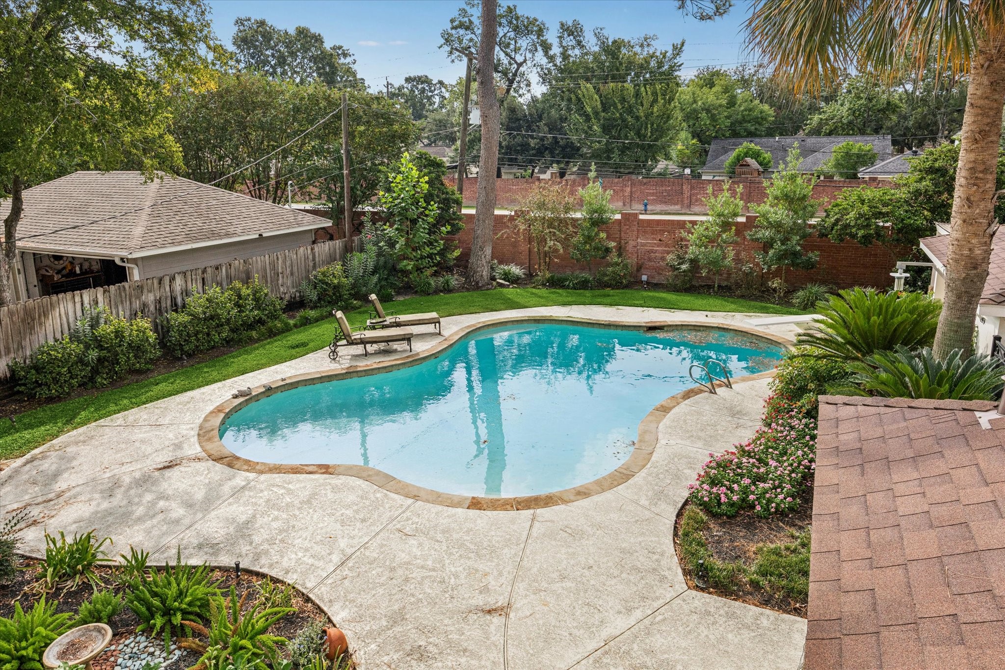 13403 Taylorcrest Road Houston, TX 77079 - Photo 24 of 38 a view of a swimming pool with a yard