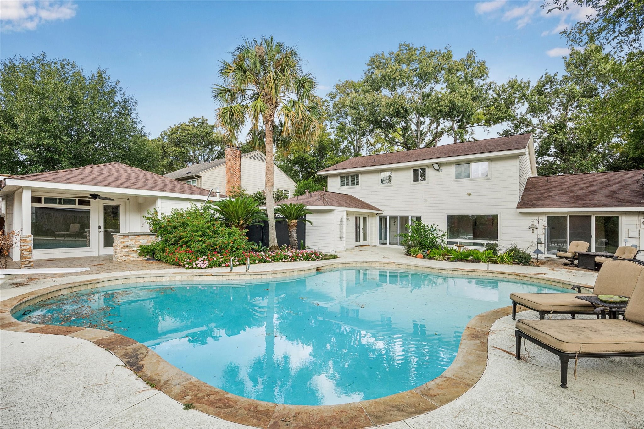 13403 Taylorcrest Road Houston, TX 77079 - Photo 26 of 38 a view of a house with swimming pool and sitting area