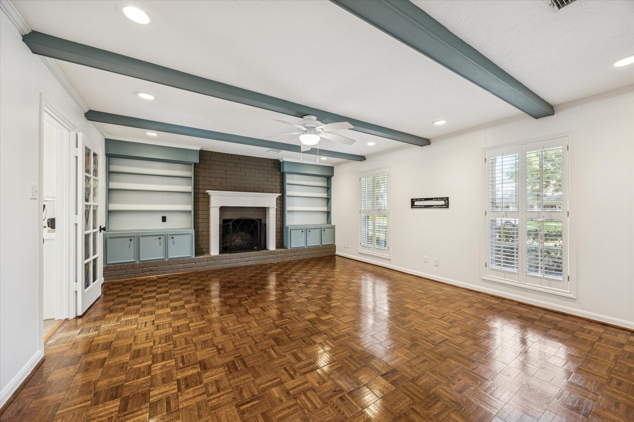 13403 Taylorcrest Road Houston, TX 77079 - Photo 4 of 38 a view of an empty room with a fireplace and a window