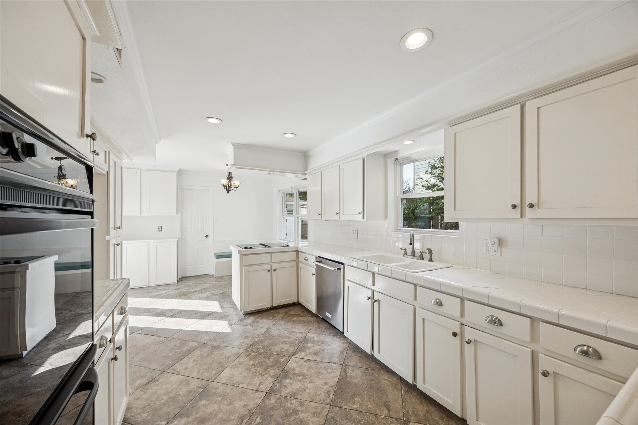 13403 Taylorcrest Road Houston, TX 77079 - Photo 5 of 38 a kitchen with a sink stove and refrigerator