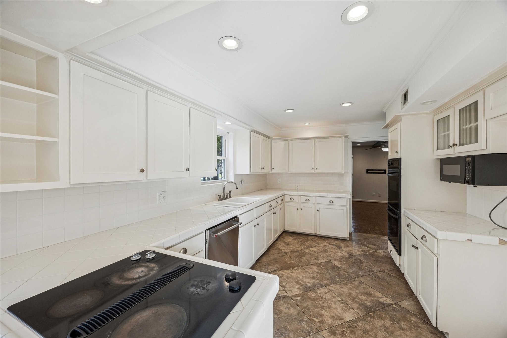 13403 Taylorcrest Road Houston, TX 77079 - Photo 6 of 38 a kitchen with a sink stove and cabinets