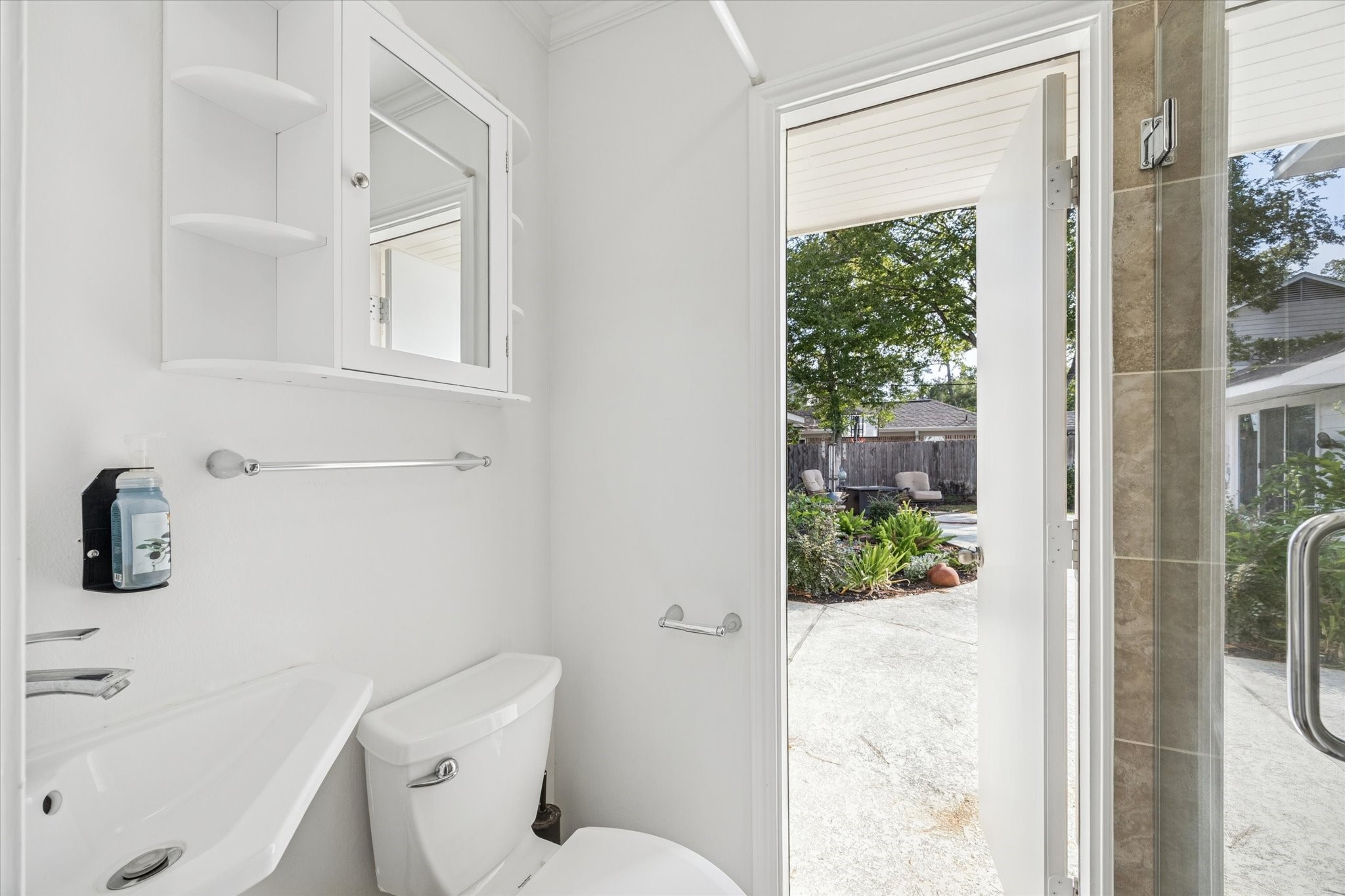 13403 Taylorcrest Road Houston, TX 77079 - Photo 8 of 38 a white toilet sitting next to a bathroom sink