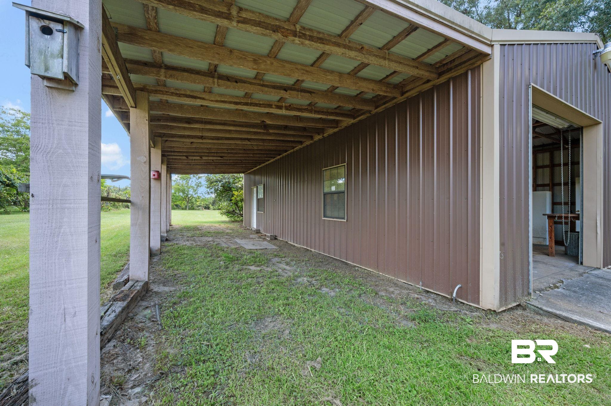 15880 Pine Grove Rd Extension West Bay Minette, AL 36507 - Photo 14 of 44 View of property exterior featuring a lawn
