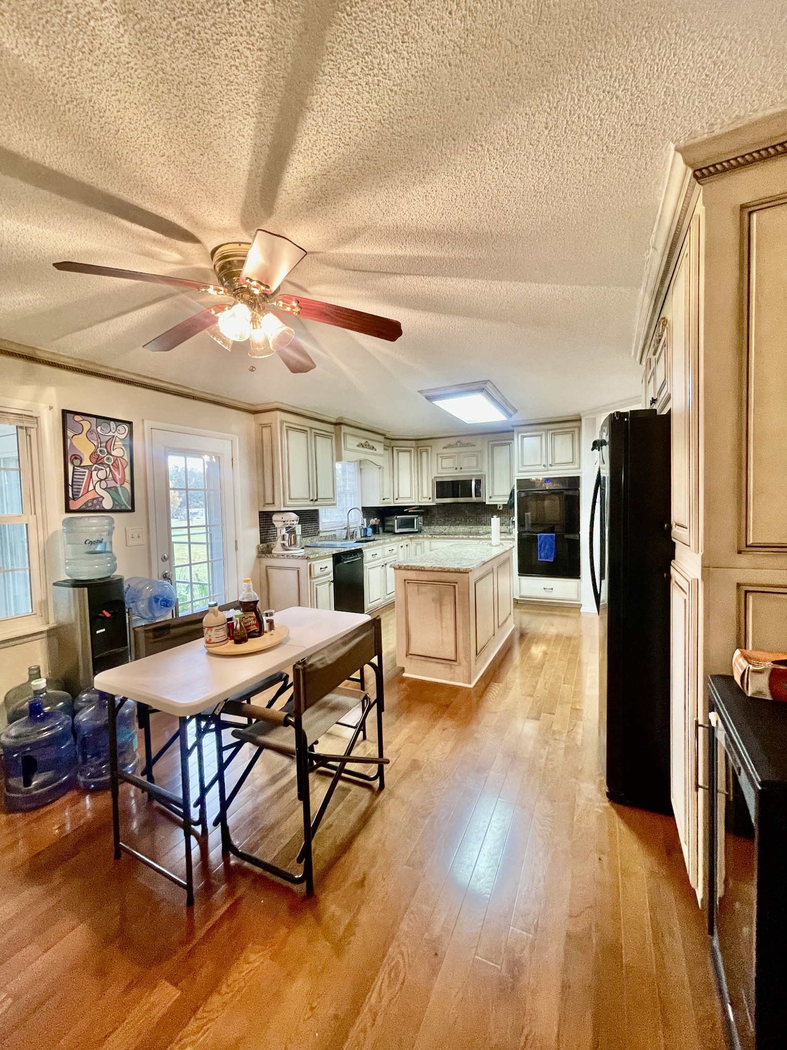 858 Ethridge Red Hill Road Lawrenceburg, TN 38464 - Photo 20 of 46 a view of a dining room with furniture window and wooden floor
