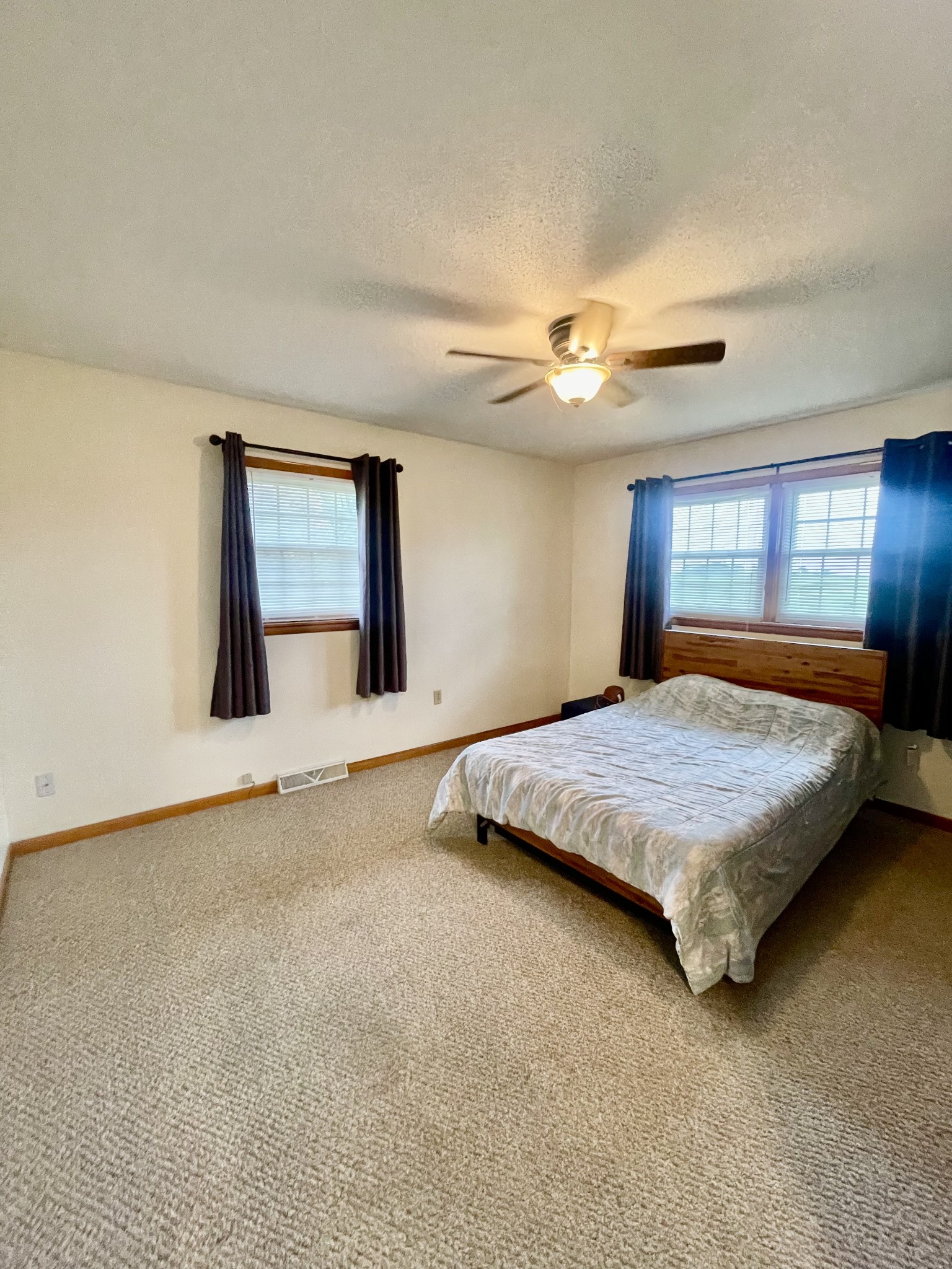 858 Ethridge Red Hill Road Lawrenceburg, TN 38464 - Photo 30 of 46 a bedroom with a large bed and a chandelier fan