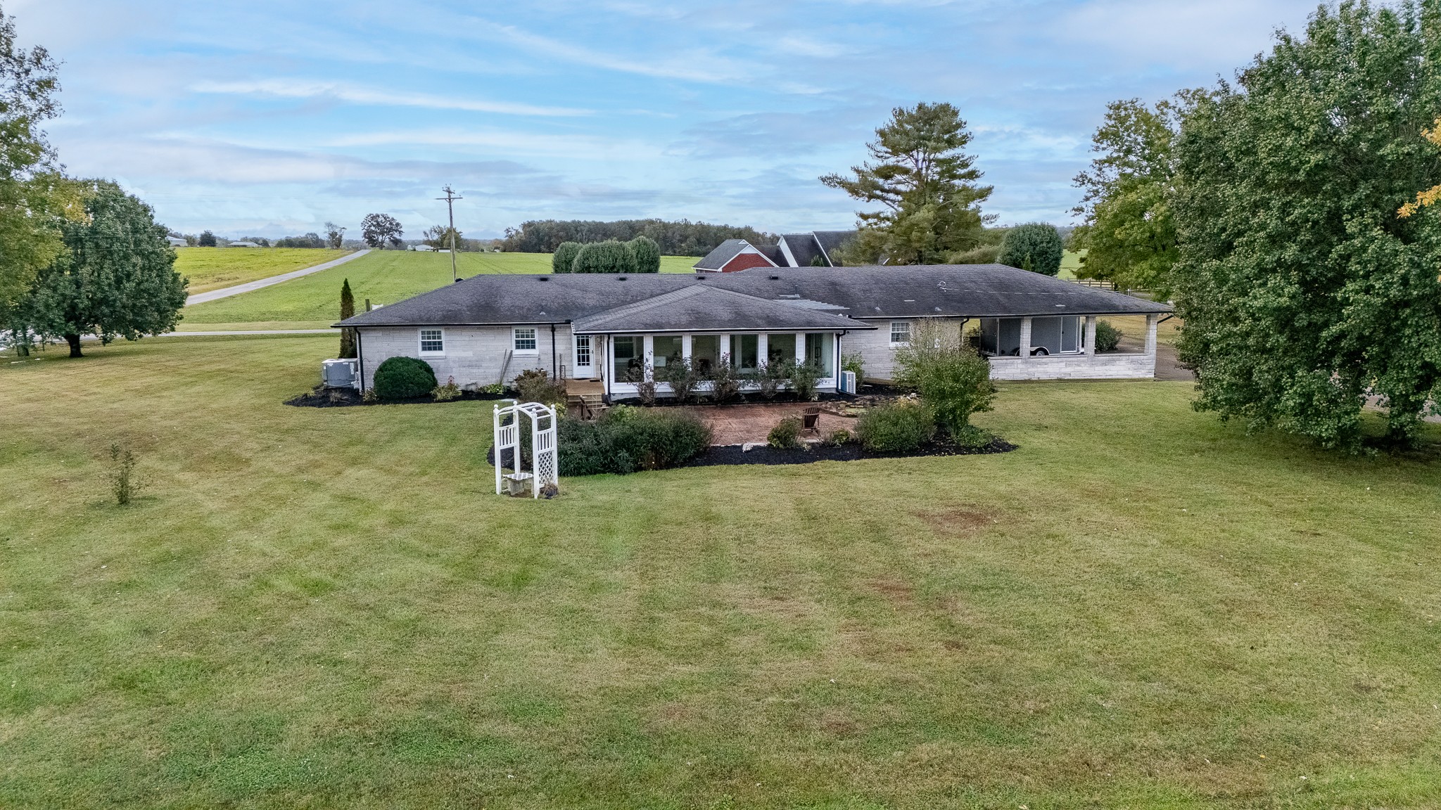 858 Ethridge Red Hill Road Lawrenceburg, TN 38464 - Photo 44 of 46 a view of a house with a yard and sitting area