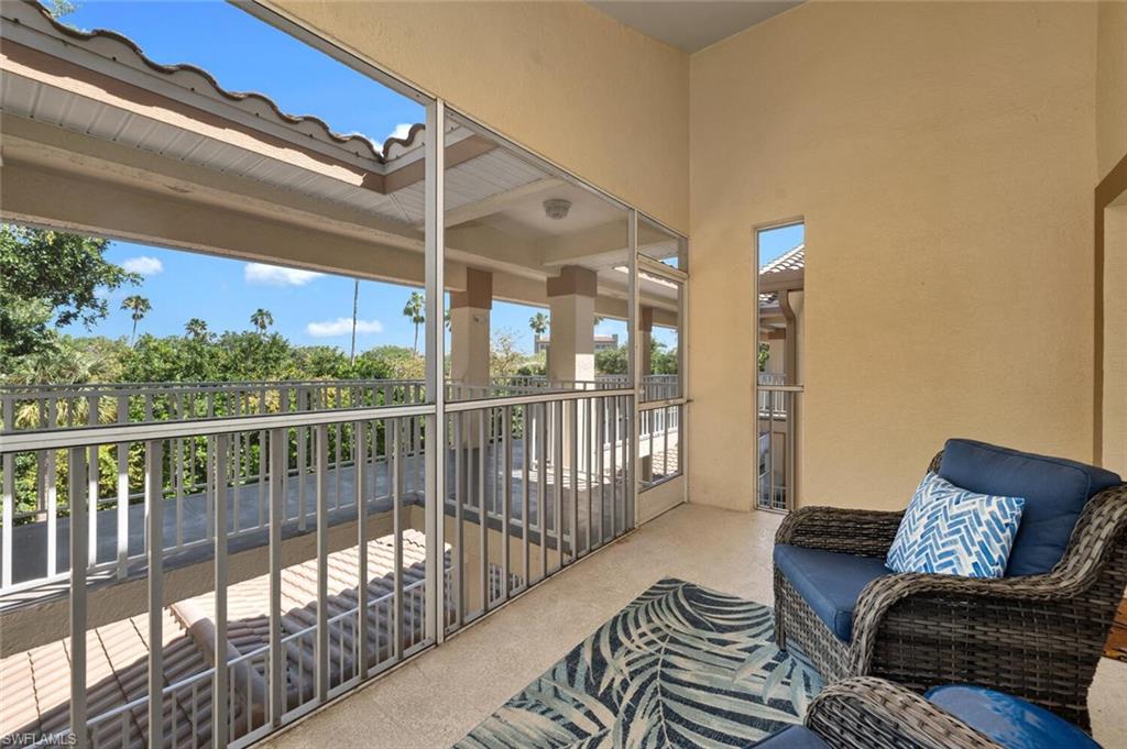 6010 Chardonnay Lane, Unit 304 Naples, FL 34119 - Photo 14 of 29 a view of a balcony with furniture
