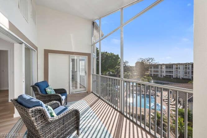 6010 Chardonnay Lane, Unit 304 Naples, FL 34119 - Photo 15 of 29 a balcony view with a couch