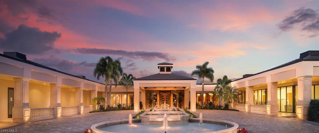6010 Chardonnay Lane, Unit 304 Naples, FL 34119 - Photo 18 of 29 a view of large building with a fountain