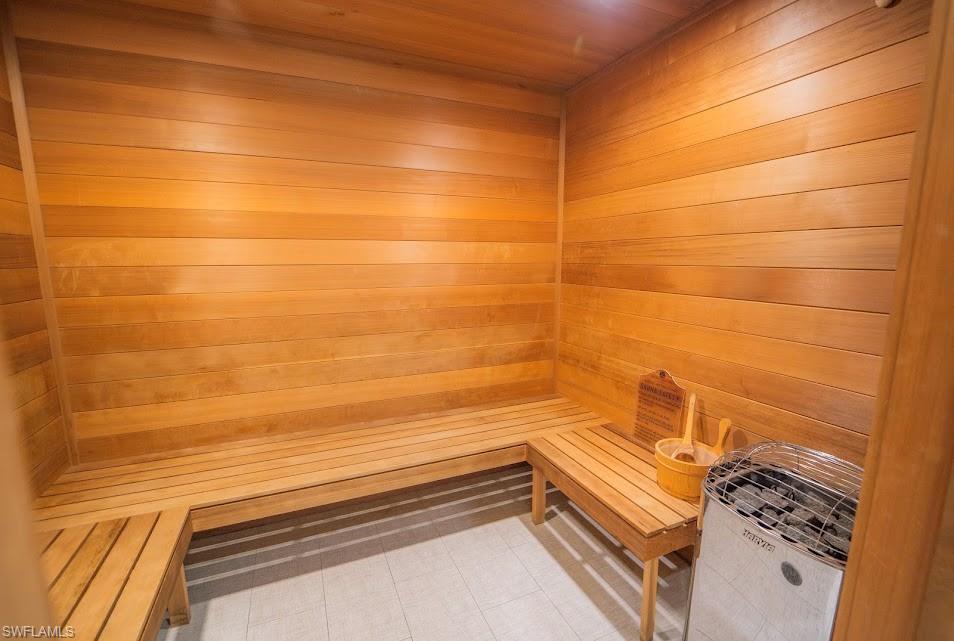 6010 Chardonnay Lane, Unit 304 Naples, FL 34119 - Photo 28 of 29 a bathroom with a bathtub and shower