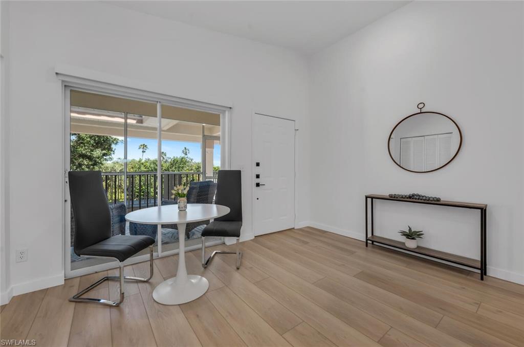 6010 Chardonnay Lane, Unit 304 Naples, FL 34119 - Photo 6 of 29 a living room with furniture and a window