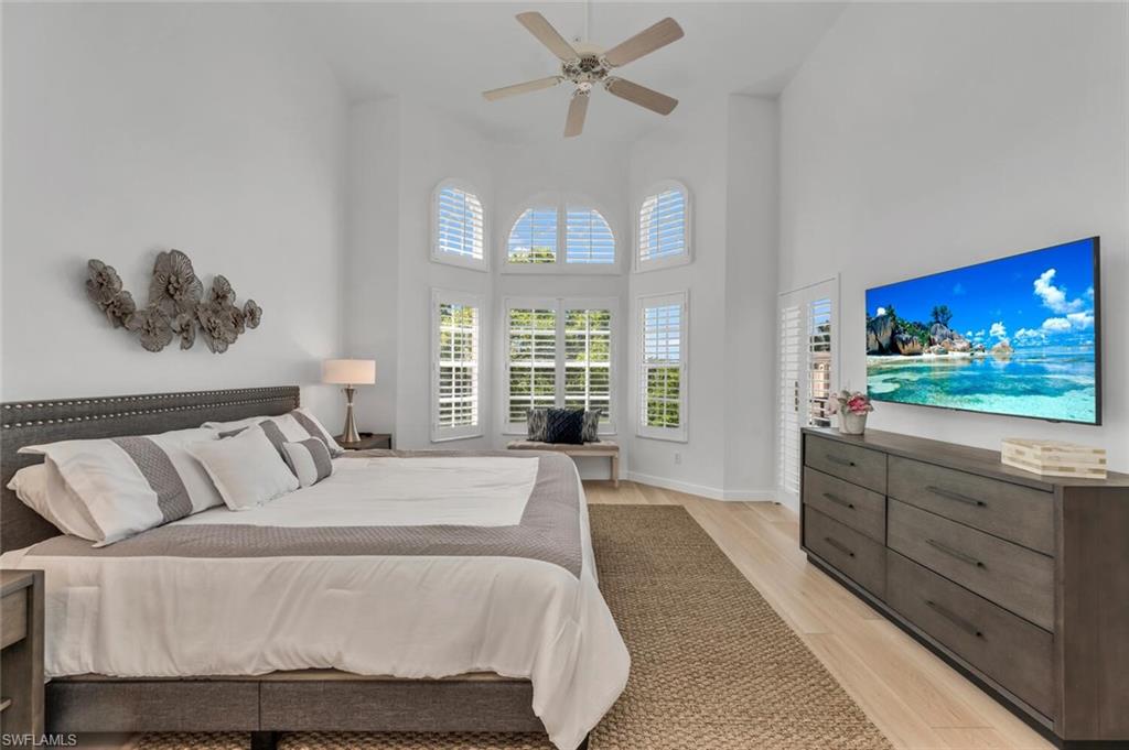 6010 Chardonnay Lane, Unit 304 Naples, FL 34119 - Photo 10 of 29 a living room with furniture and a flat screen tv