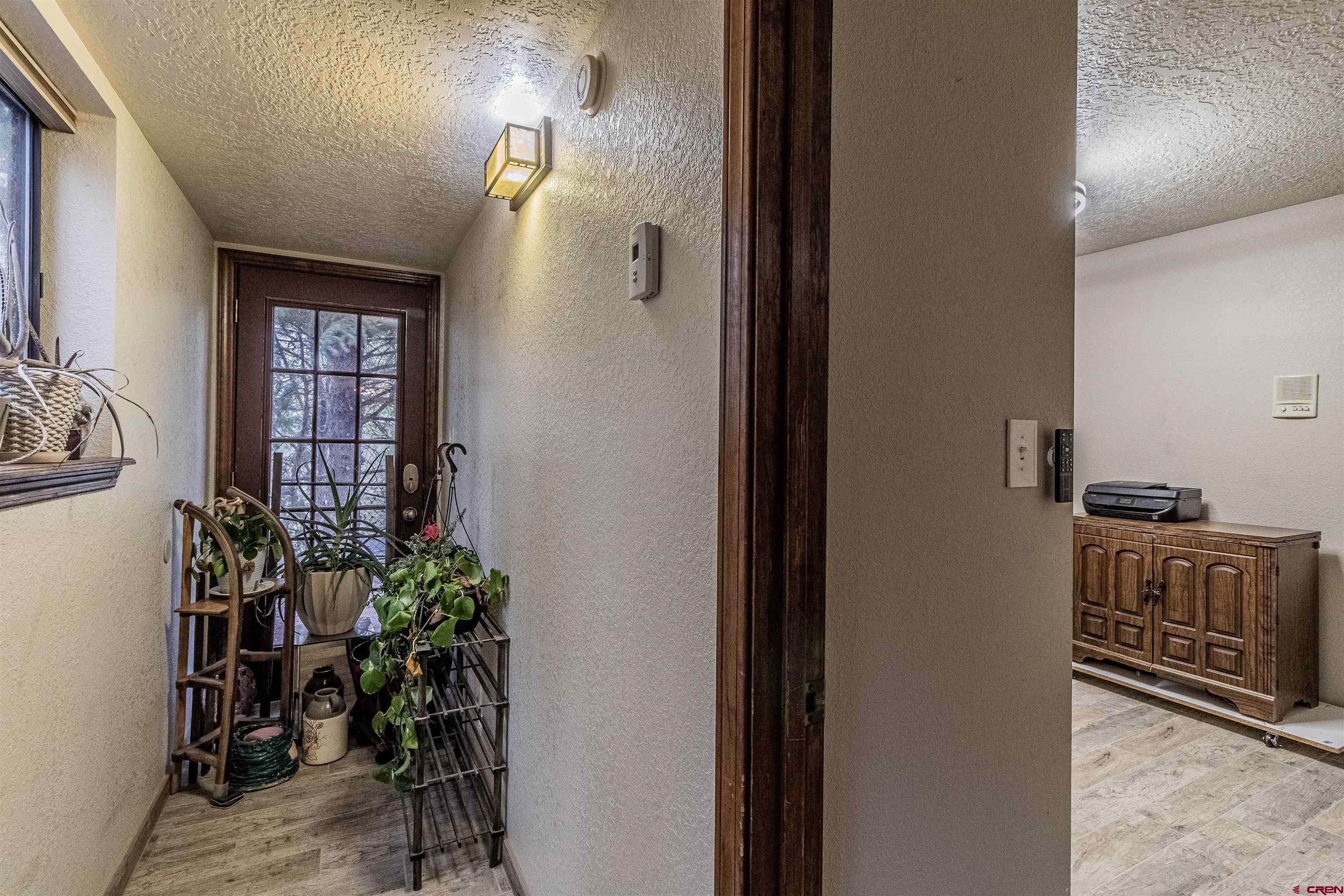 27 Road 3025 Aztec, NM 87410 - Photo 17 of 45 a view of entryway and livingroom