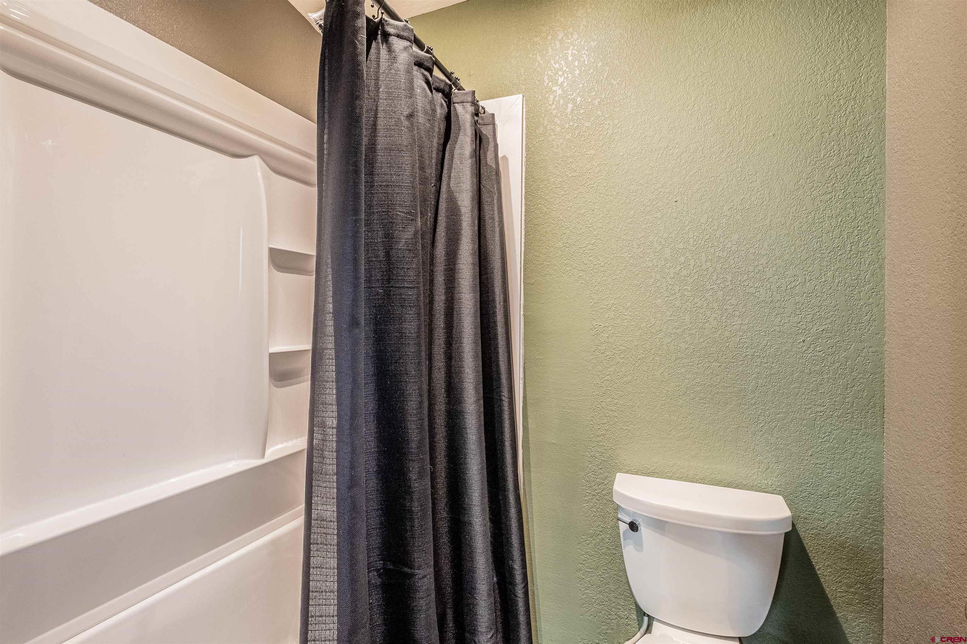 27 Road 3025 Aztec, NM 87410 - Photo 23 of 45 a bathroom with a toilet and a shower