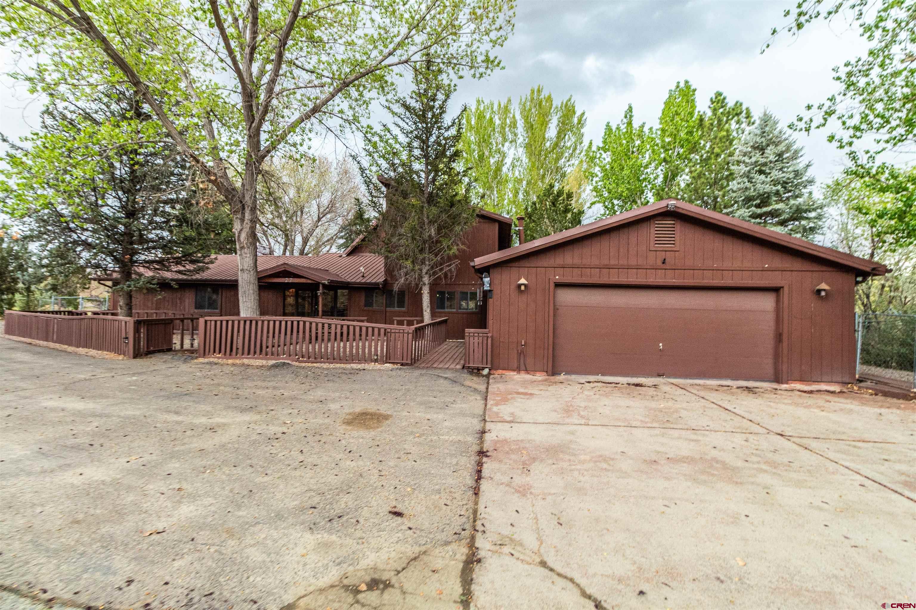 27 Road 3025 Aztec, NM 87410 - Photo 3 of 45 a house with trees in the background