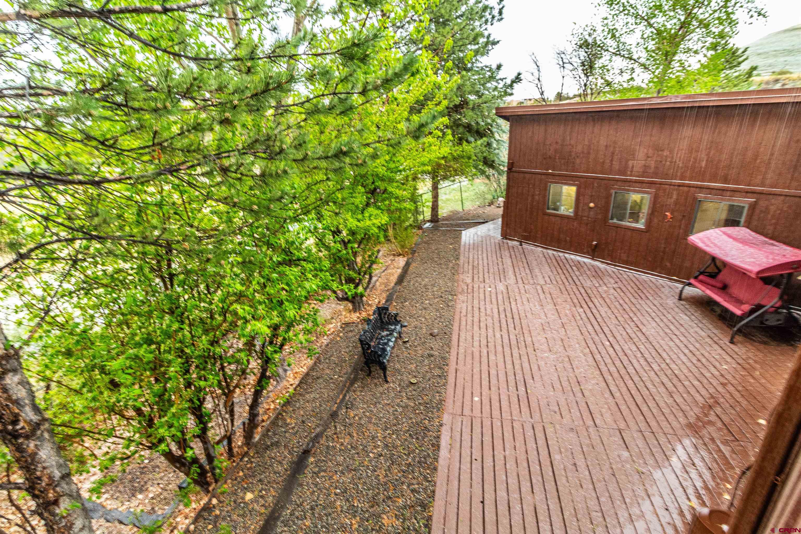 27 Road 3025 Aztec, NM 87410 - Photo 36 of 45 a view of a wooden door and a yard
