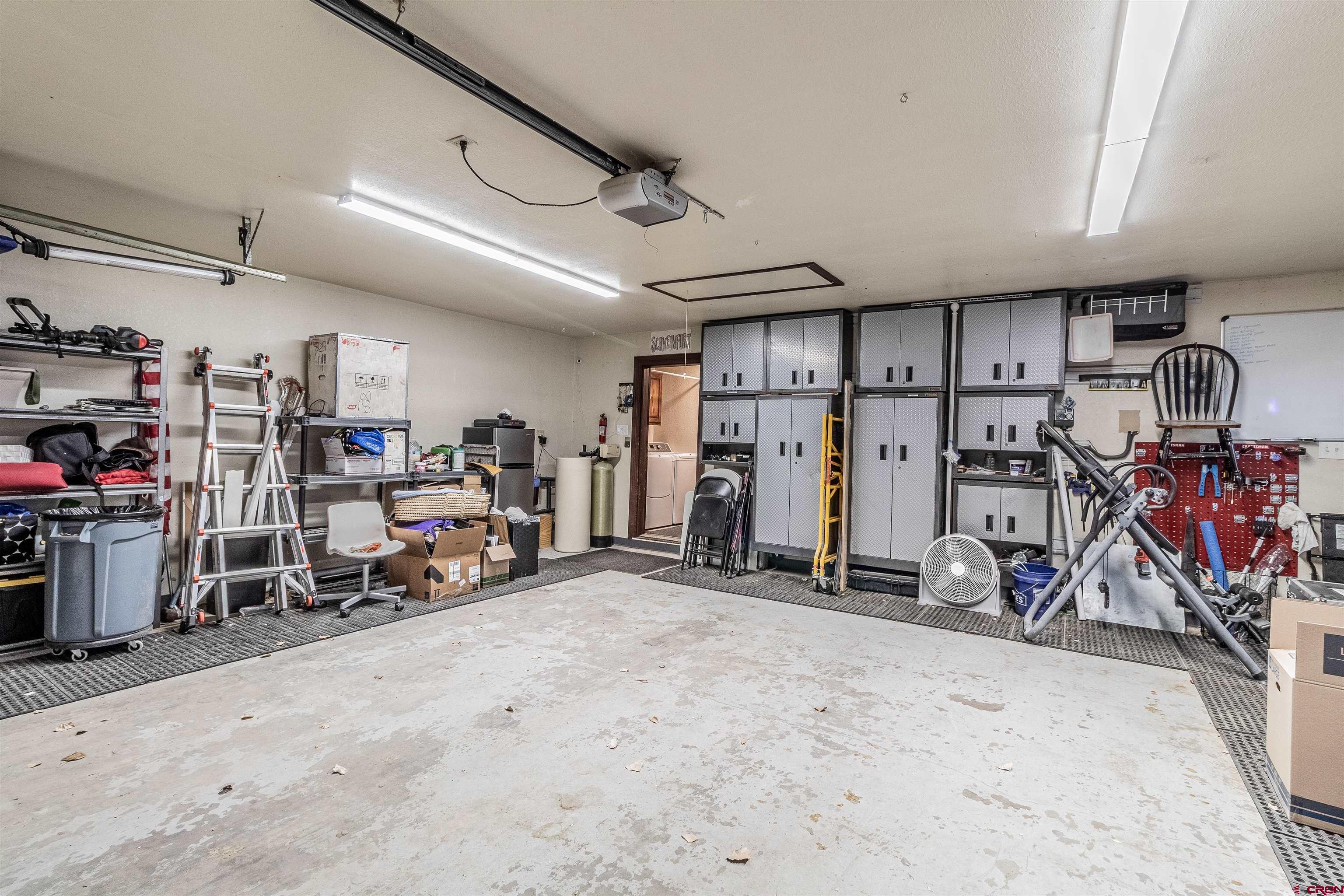 27 Road 3025 Aztec, NM 87410 - Photo 40 of 45 a view of a garage with a lot of stuff