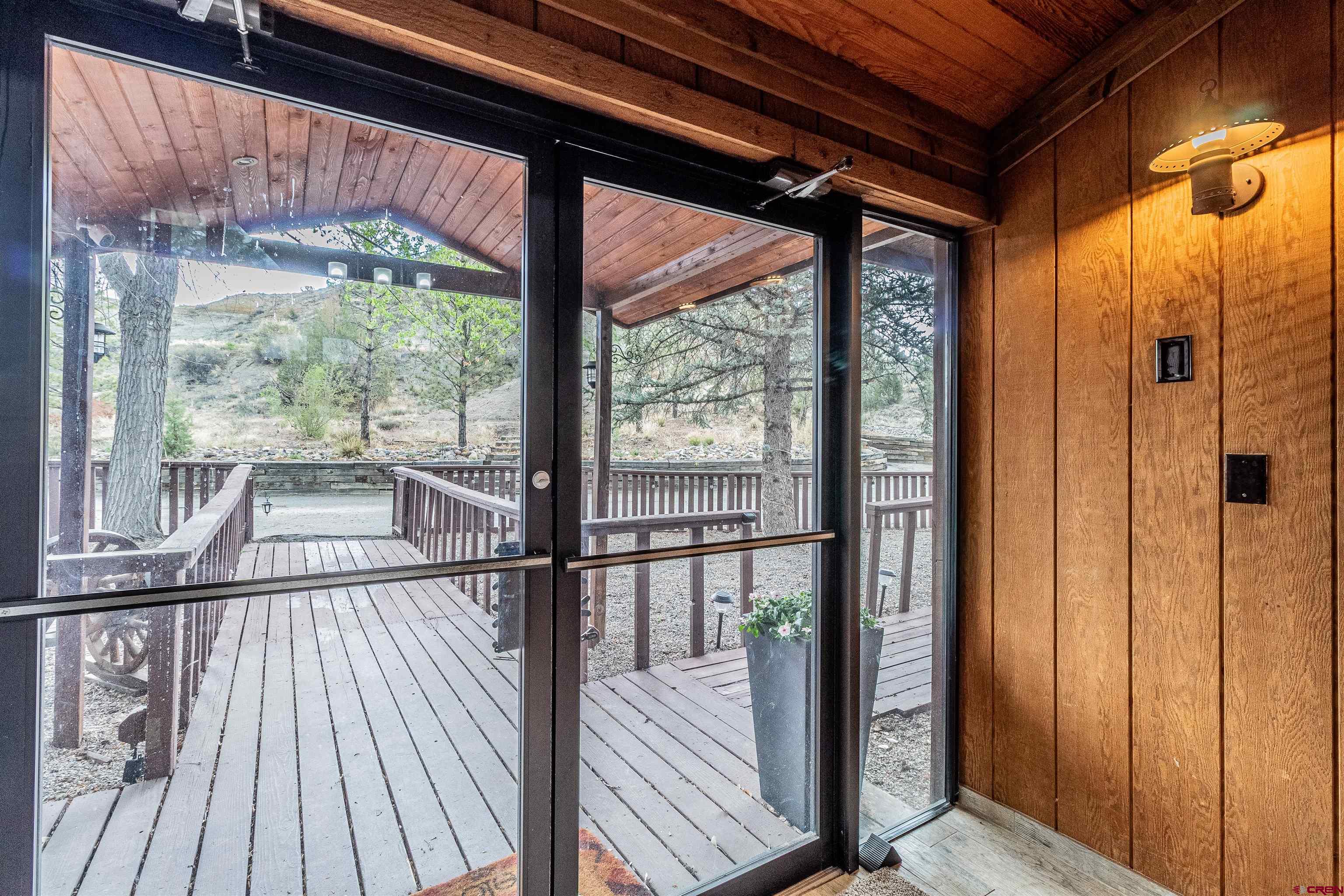 27 Road 3025 Aztec, NM 87410 - Photo 5 of 45 a view of a balcony with wooden floor
