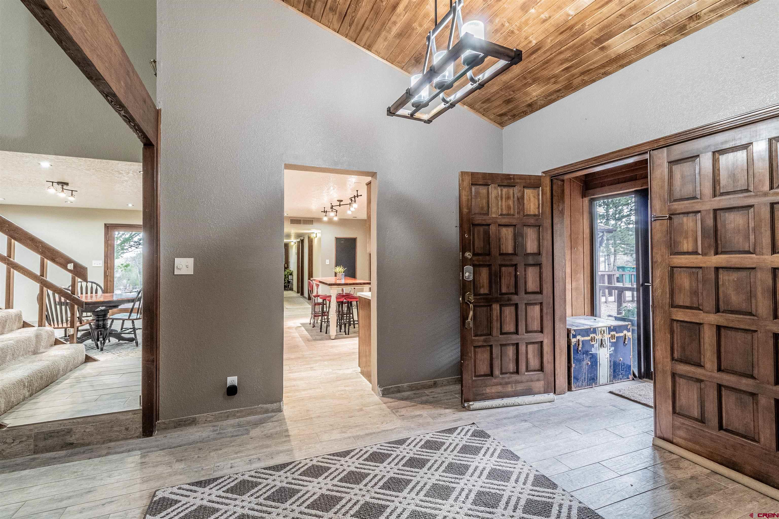 27 Road 3025 Aztec, NM 87410 - Photo 6 of 45 a view of an entryway with a bookshelf