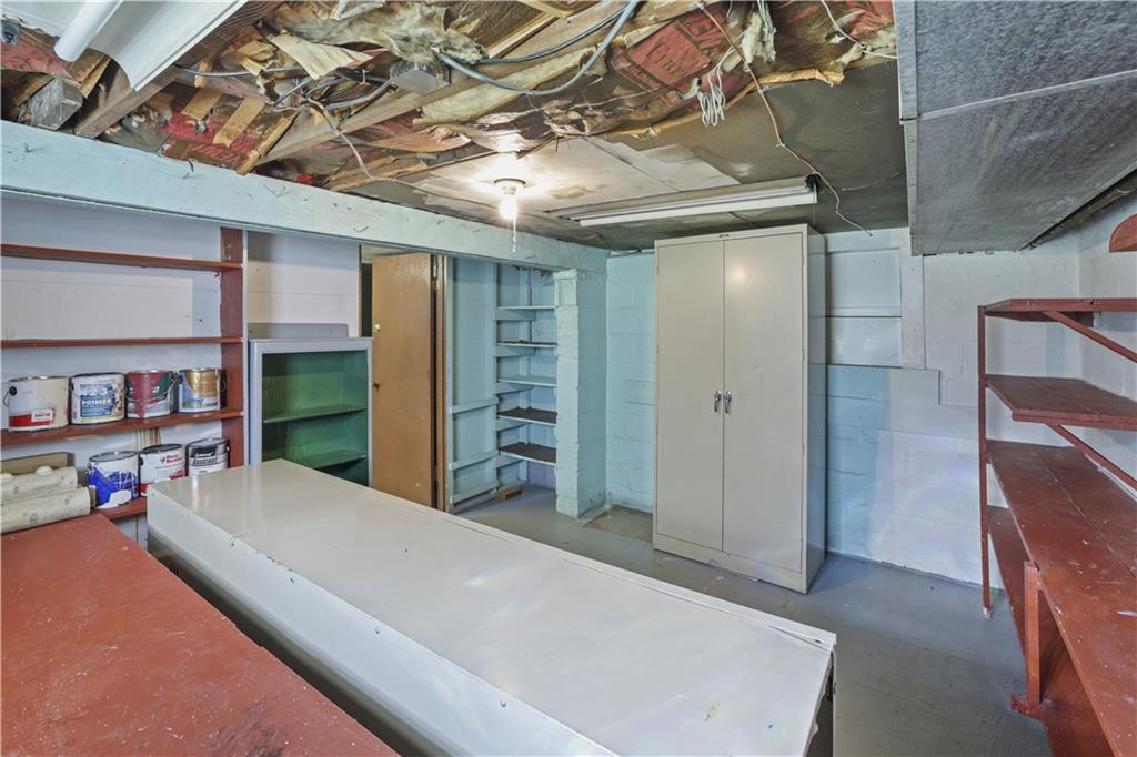 1027 Glass Run Road Pittsburgh, PA 15236 - Photo 20 of 24 a bed room with a bed and a book shelf