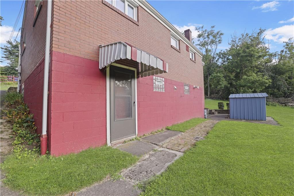 1027 Glass Run Road Pittsburgh, PA 15236 - Photo 22 of 24 a front view of a house with yard