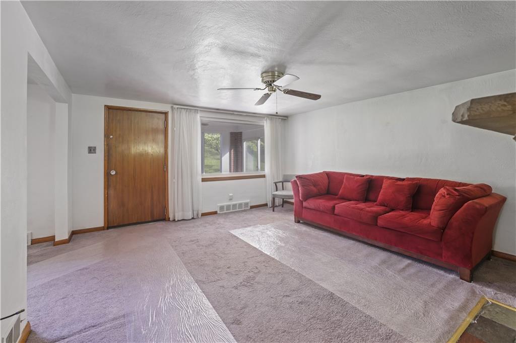 1027 Glass Run Road Pittsburgh, PA 15236 - Photo 6 of 24 a living room with furniture and a window