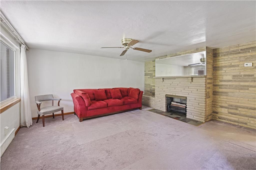 1027 Glass Run Road Pittsburgh, PA 15236 - Photo 7 of 24 a living room with furniture and a fireplace