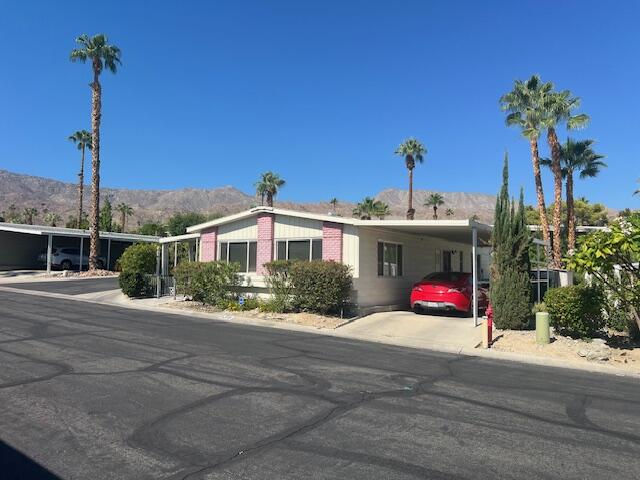 49305 Highway 74, Unit 136 Palm Desert, CA 92260 - Photo 1 of 1 a front view of a house with a porch