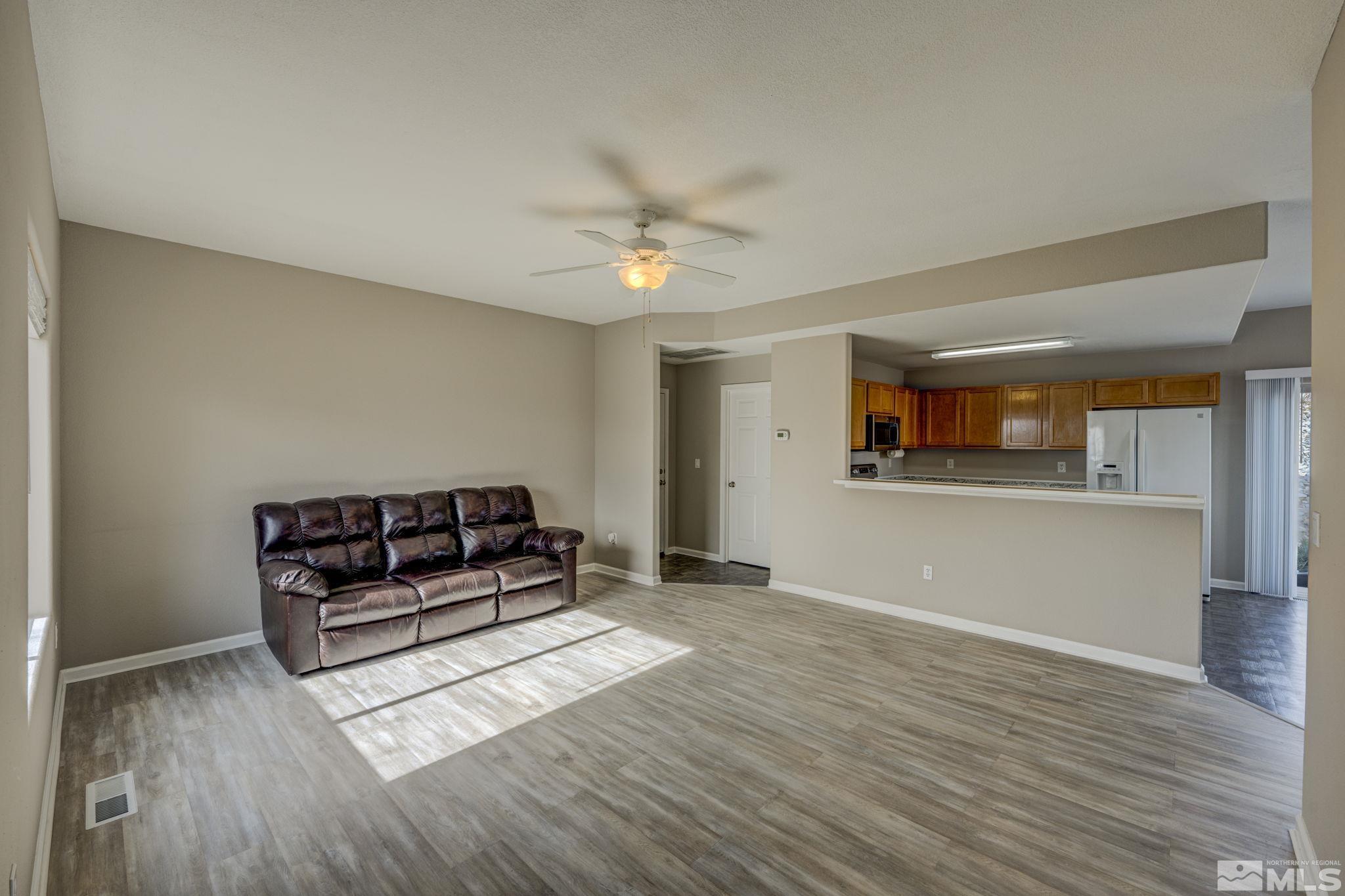 5155 Emery Drive Reno, NV 89506 - Photo 12 of 38 a living room with furniture and a ceiling fan