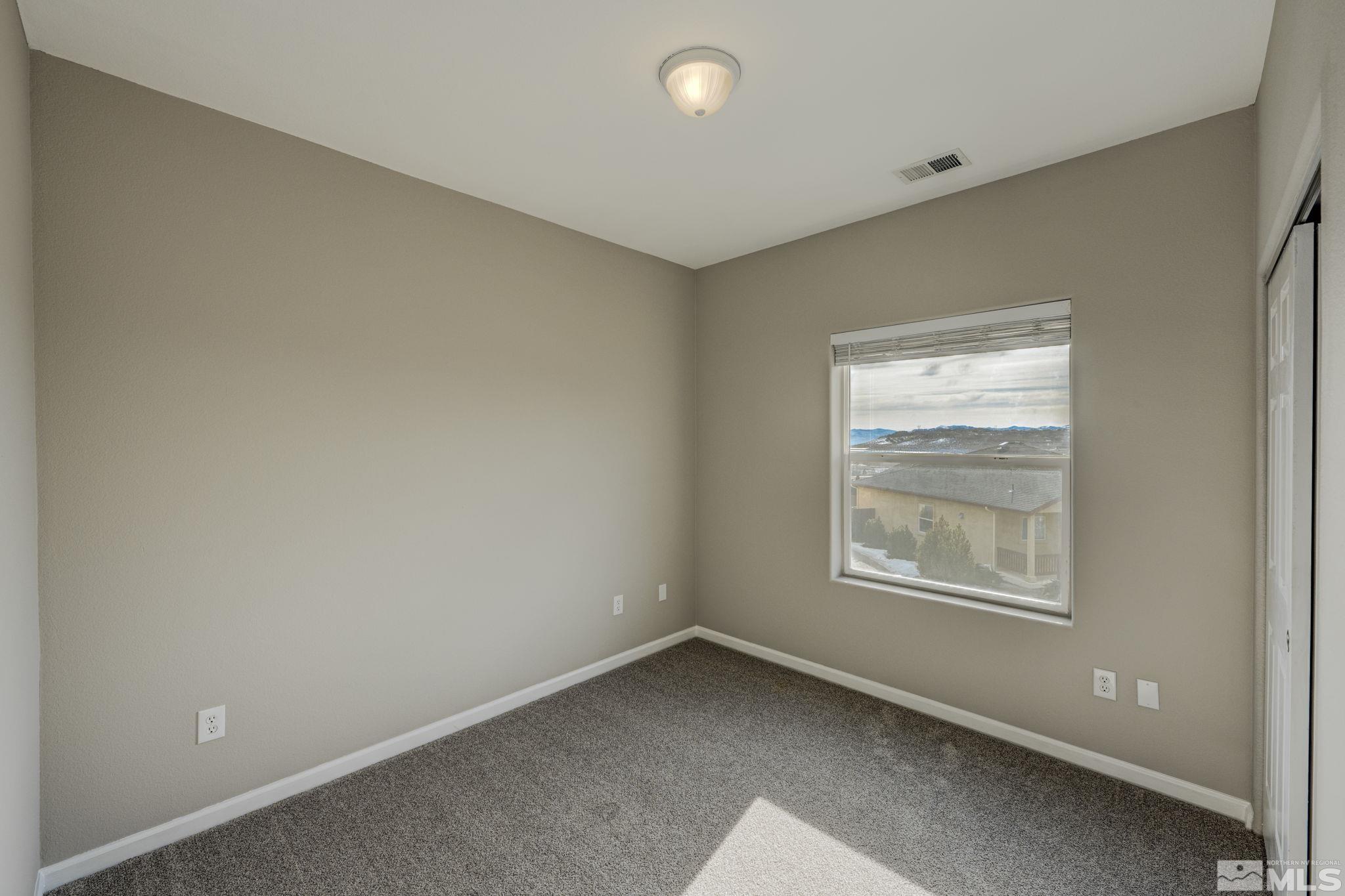 5155 Emery Drive Reno, NV 89506 - Photo 14 of 38 an empty room with windows