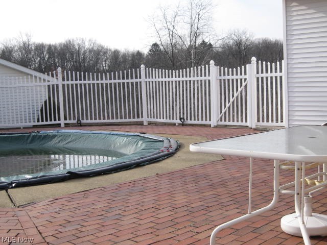 2510 Killian Road Uniontown, OH 44685 - Photo 15 of 27 NOTICE THE PAVERS -- - - - - - - VINYL FENCING - - - - - - IN POOL AREA - - - - - - - - - -