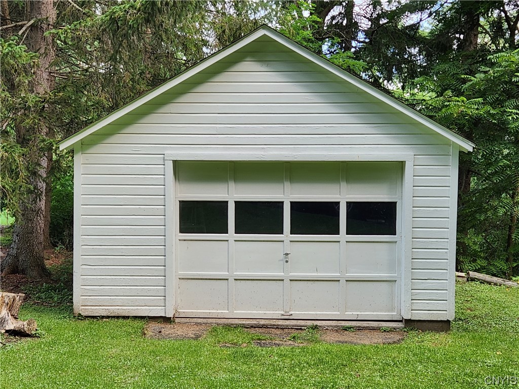 35 West Lake Road Skaneateles, NY 13152 - Photo 1 of 1 Southwest boundary stake left of garage cir.1945 m