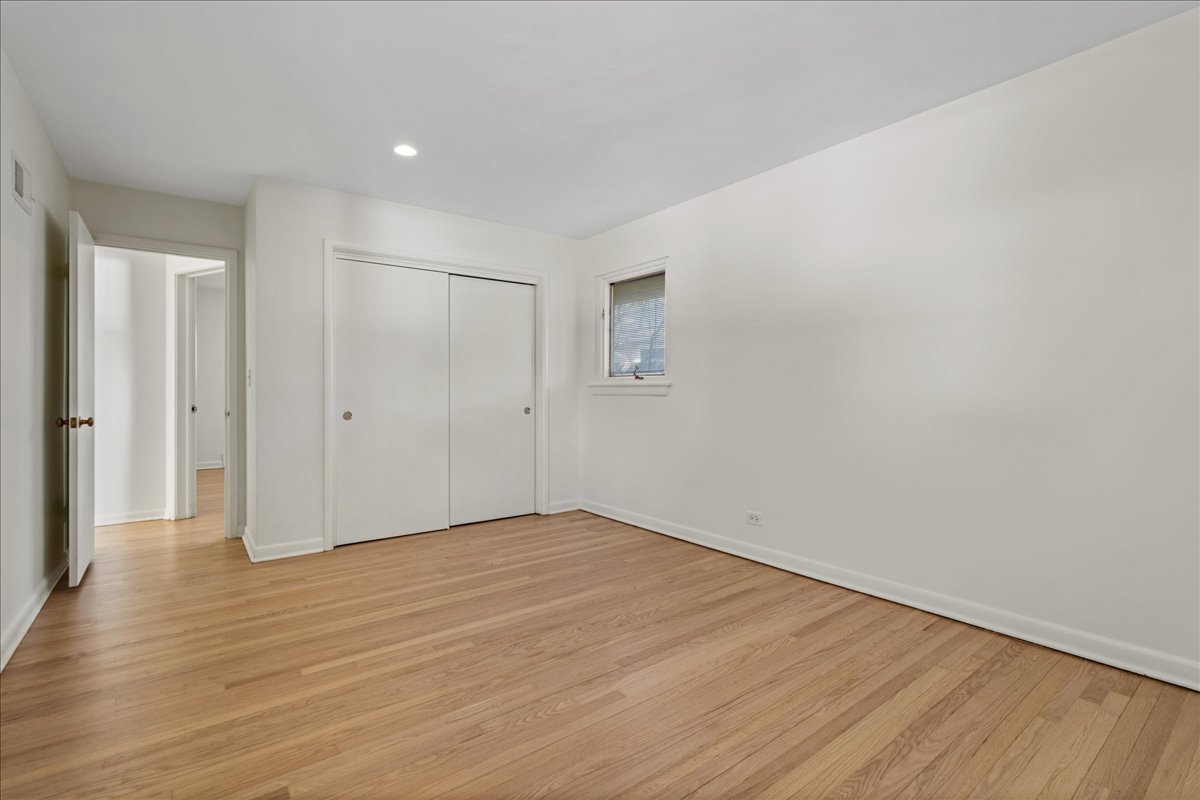 8314 Gross Point Road Morton Grove, IL 60053 - Photo 12 of 28 a view of an empty room with wooden floor