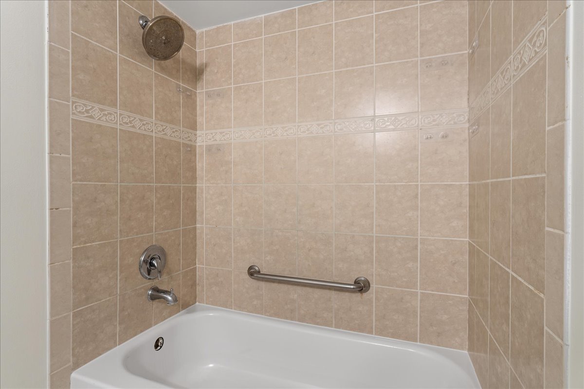 8314 Gross Point Road Morton Grove, IL 60053 - Photo 25 of 28 a bathroom with a bathtub and shower