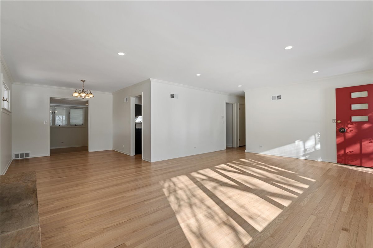8314 Gross Point Road Morton Grove, IL 60053 - Photo 6 of 28 a view of a livingroom with wooden floor