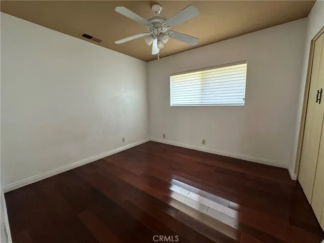a view of wooden floor in an empty room