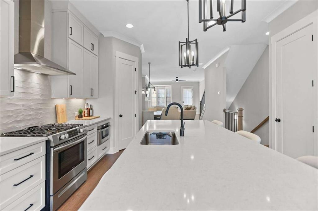 4466 Lemon Street Acworth, GA 30101 - Photo 27 of 65 a kitchen with stainless steel appliances a stove a sink and a refrigerator