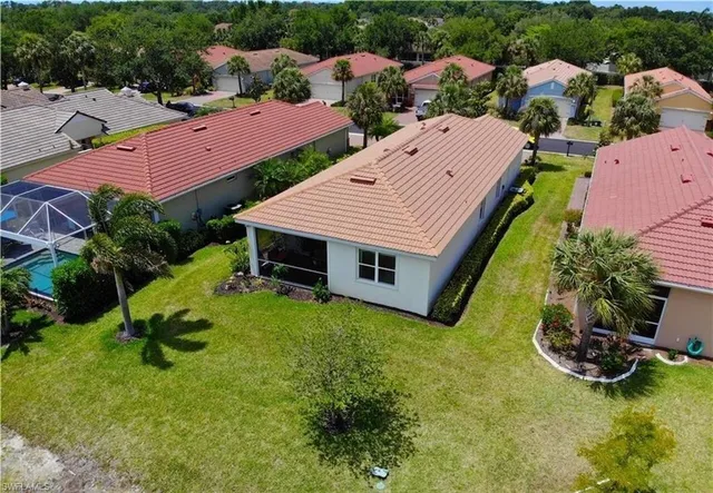 an aerial view of a house with swimming pool garden and outdoor seating