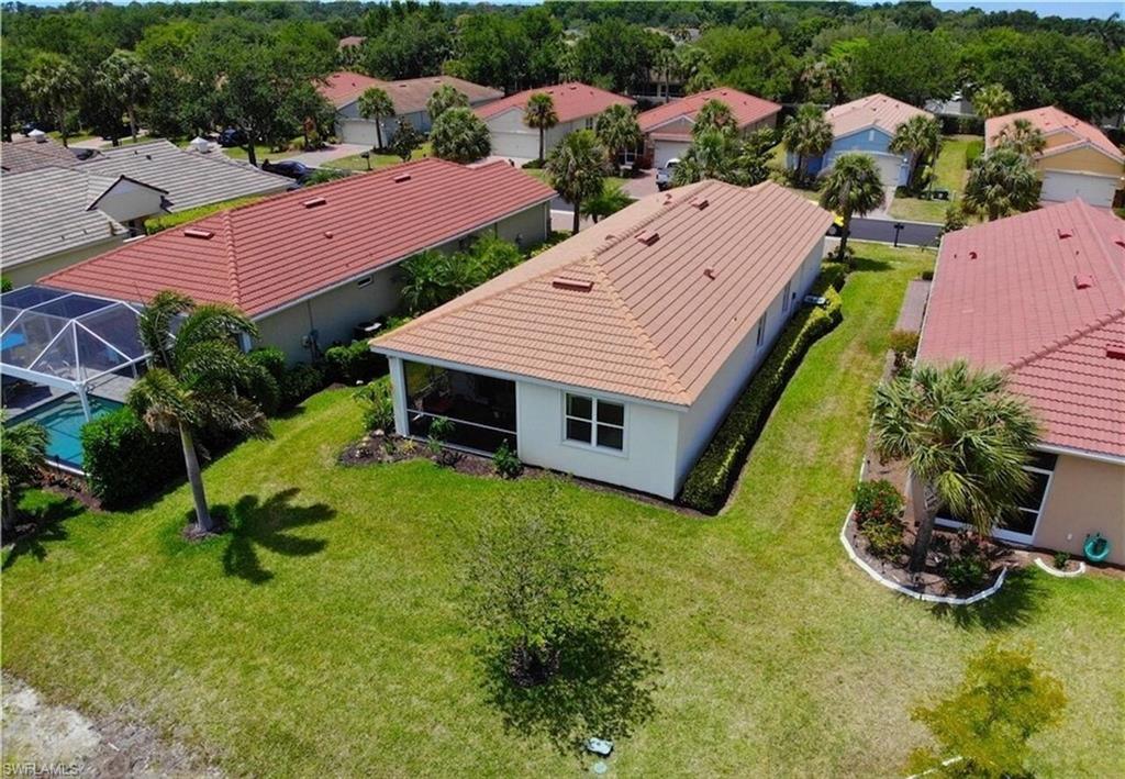 an aerial view of a house with swimming pool garden and outdoor seating