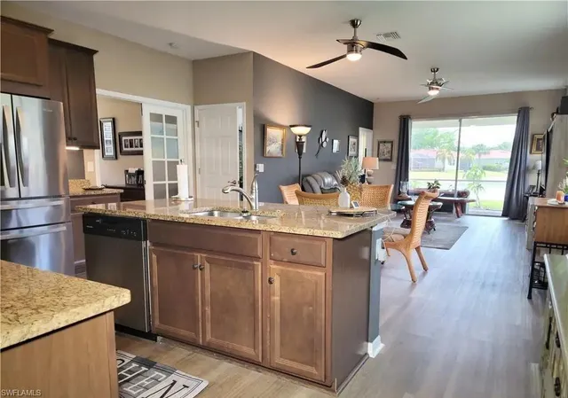 a kitchen with lots of counter top space and stainless steel appliances