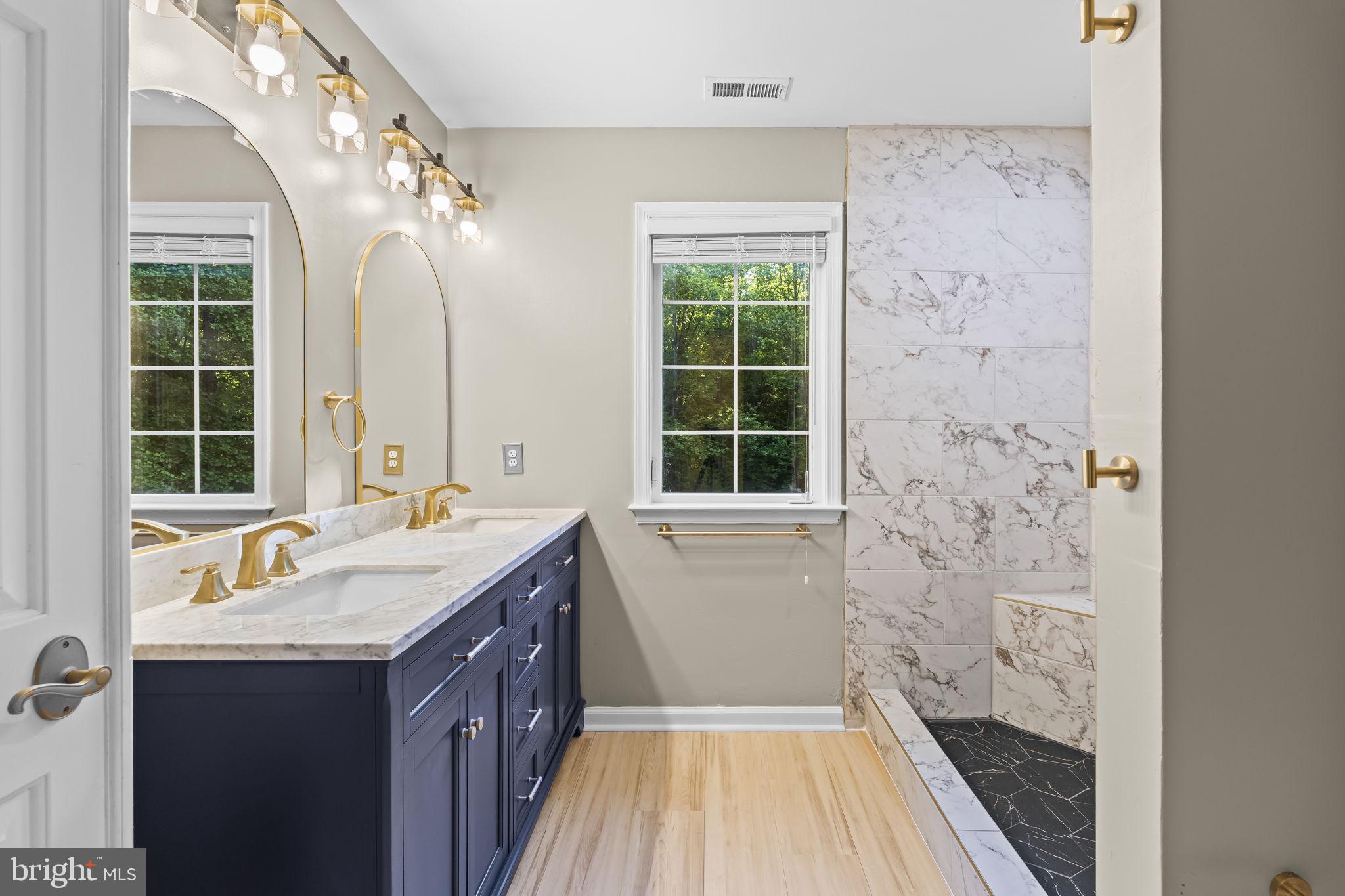 210 Walnut Creek Road Huntingtown, MD 20639 - Photo 23 of 47 Elegant bathroom with modern finishes.