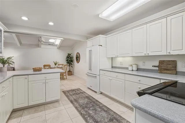 a dining room with furniture and a mirror