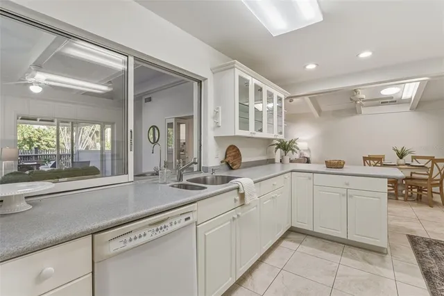 a living room with furniture and a painting on the wall